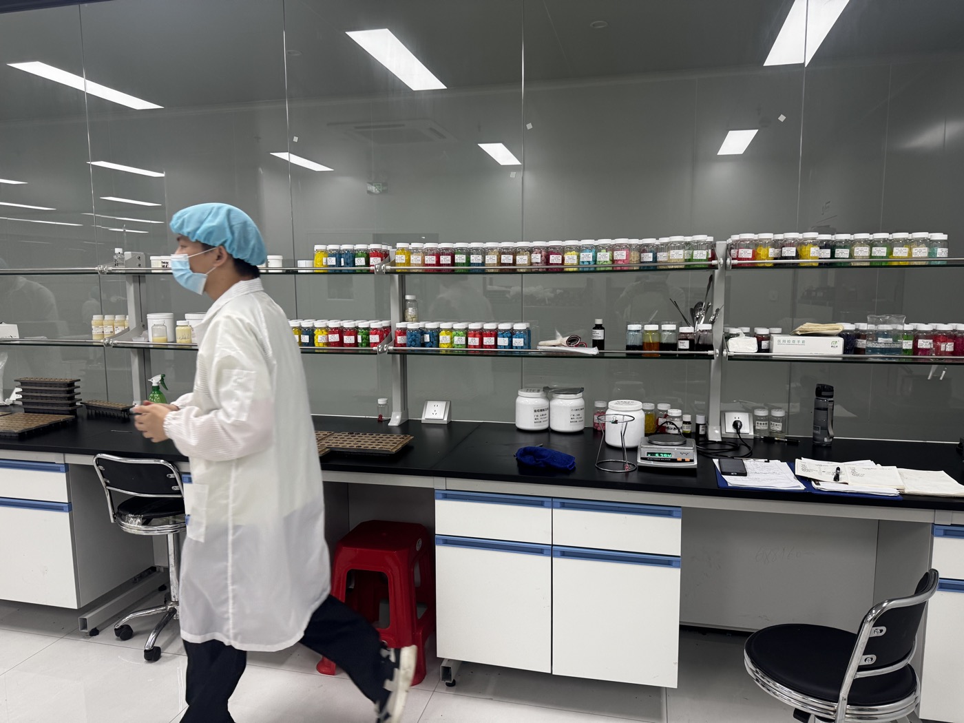 Formulation team working beside a raw material sample library